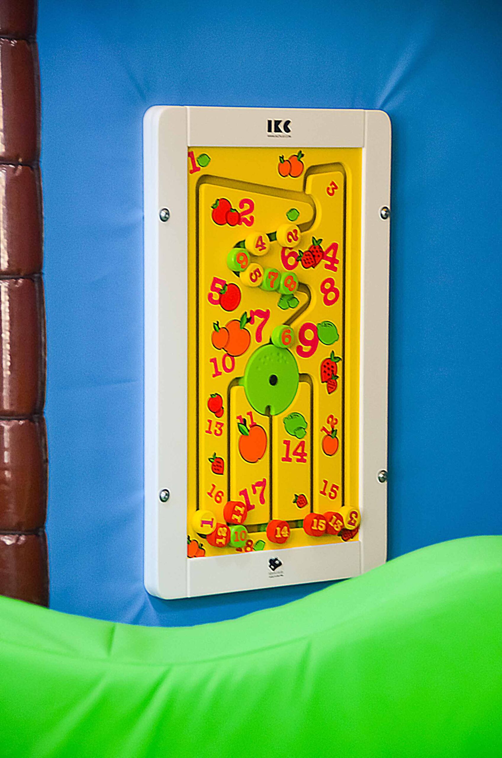 IKC interactive wall panel, this is a shape puzzle on a blue vinyl wall at Thorpe Farm.