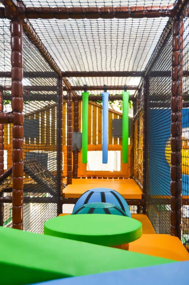 Blue and Orange Bouncy Ball Board and blue and green wedge floor at Thorpe Farm's indoor softplay area