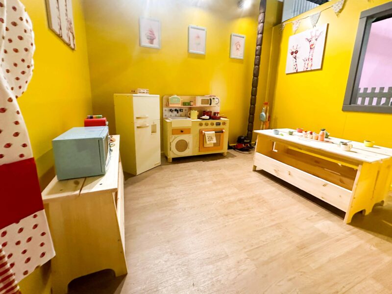 Yellow kitchen themed softplay roleplay area created for Brocksbushes play barn. Designed by Play Creations.