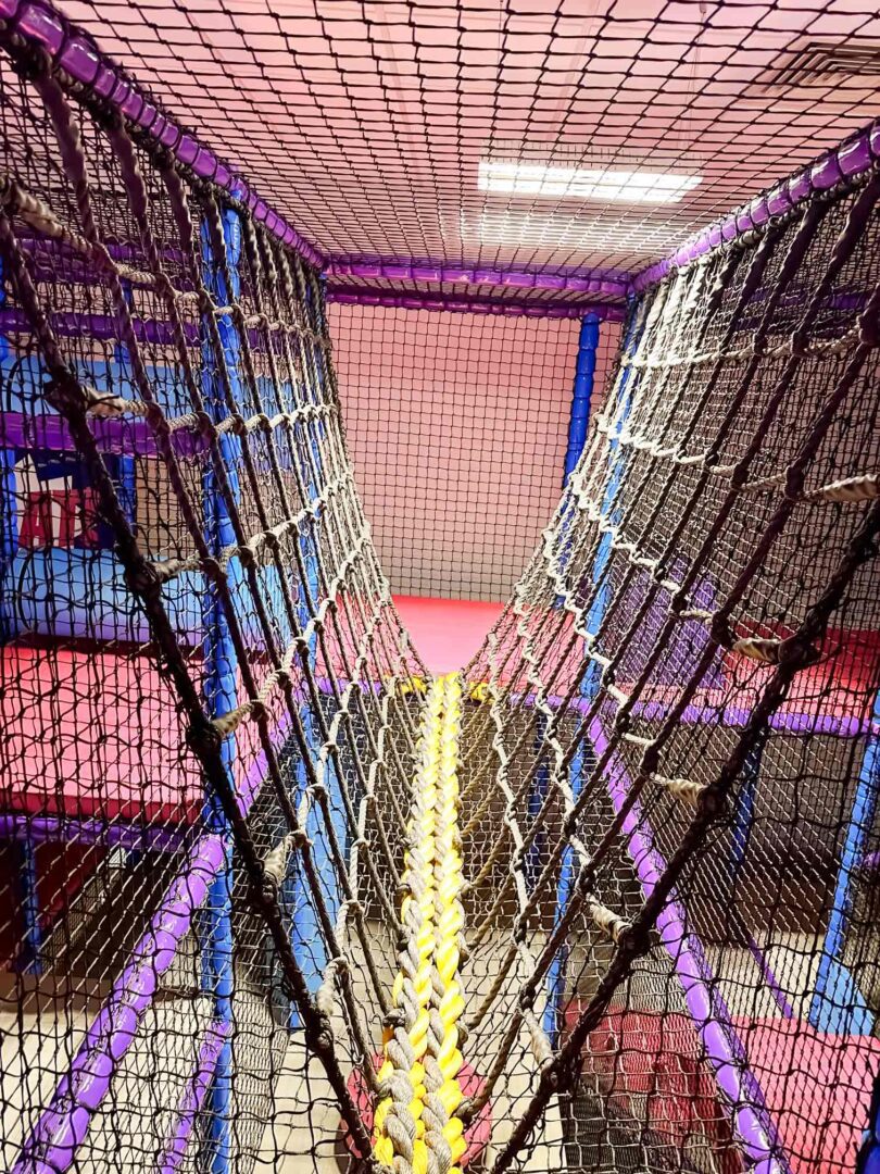 Black and yellow V-Net Bridge at RAF Lakenheath's indoor softplay area, designed by Play Creations