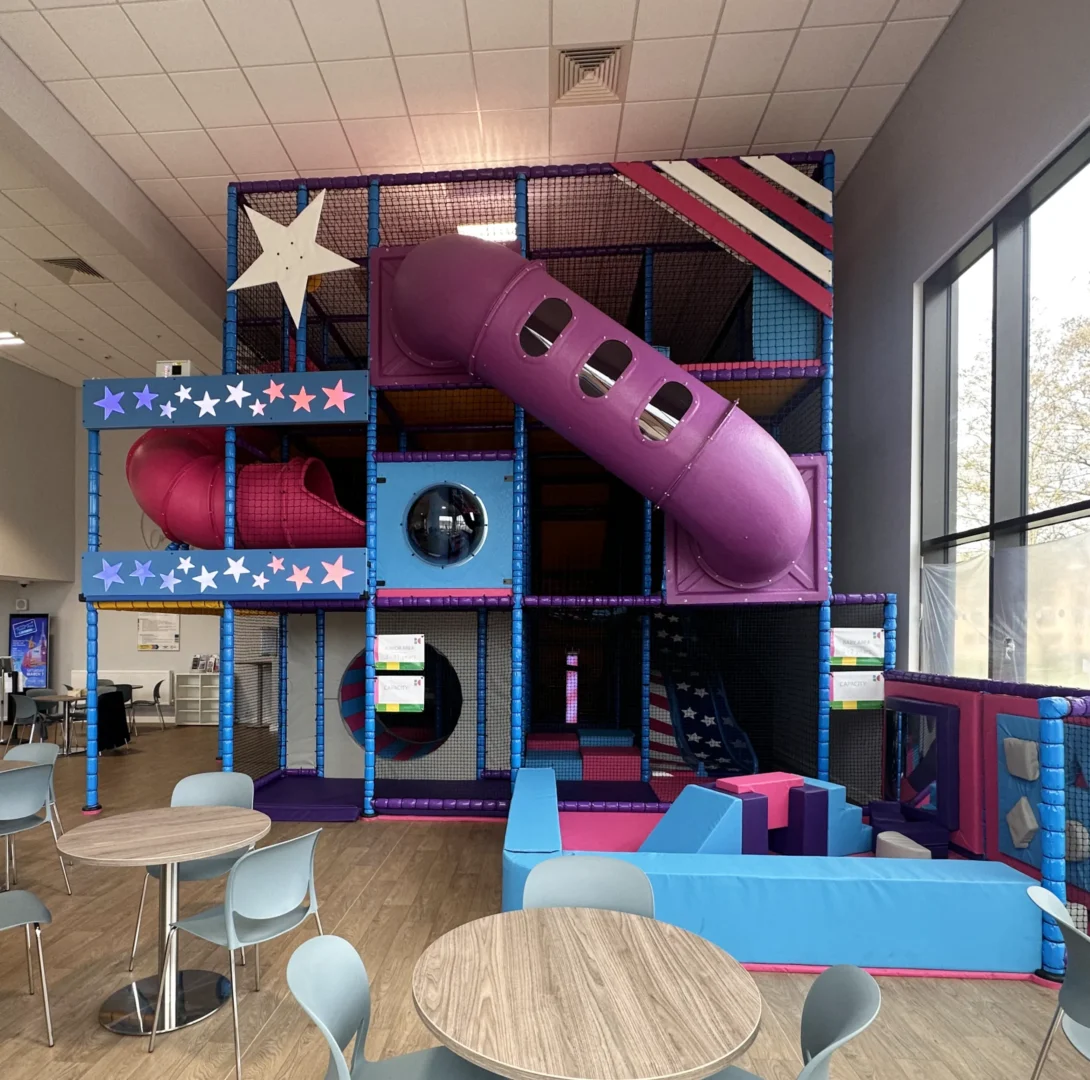 RAF Lakenheath's purple, blue and pink stars and stripes themed indoor softplay area, designed by Play Creations