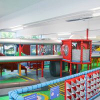 RAF Museum's indoor softplay featuring an aviation theme. The softplay is designed to look like a plane with a red and silver theme. The ground represents a runway to match the theme. Designed by Play Creations.