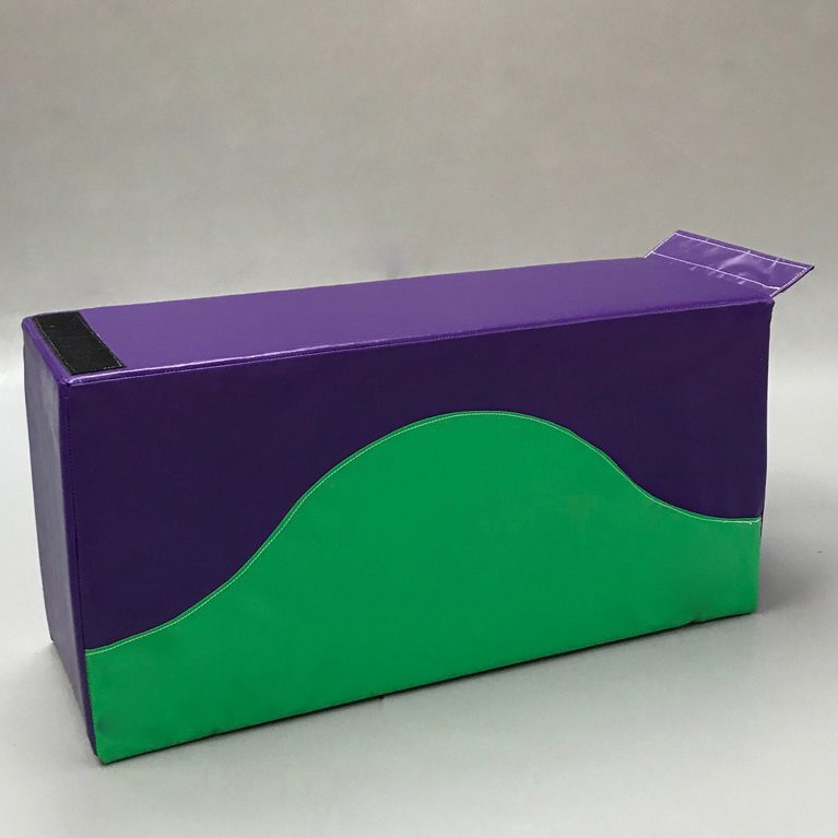 Play Creations' portable softplay retainer block in green and purple with the green sweeping halfway up the block like a hill. View from the front