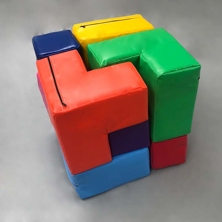 3D Puzzle Block, made up of a variety of shaped and coloured blocks. All fit together to make a cube.