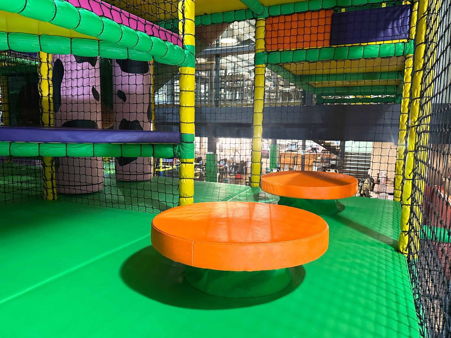 Orange and Green Spring Steps at Cannon Hall Farm's indoor softplay area, designed by Play Creations.