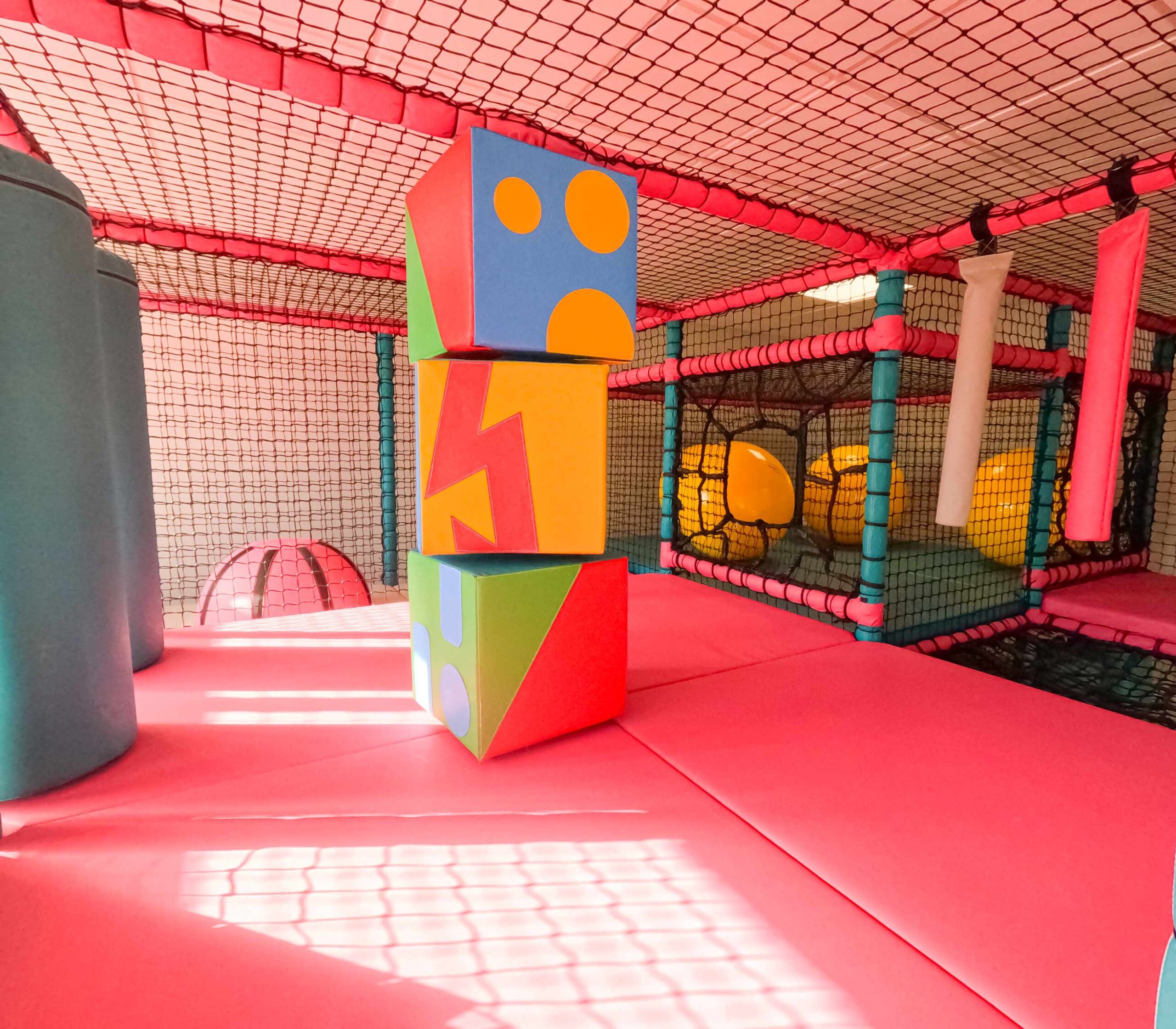 Colourful spinning totem pole at Rushall Schools interactive indoor softplay, designed by Play Creations