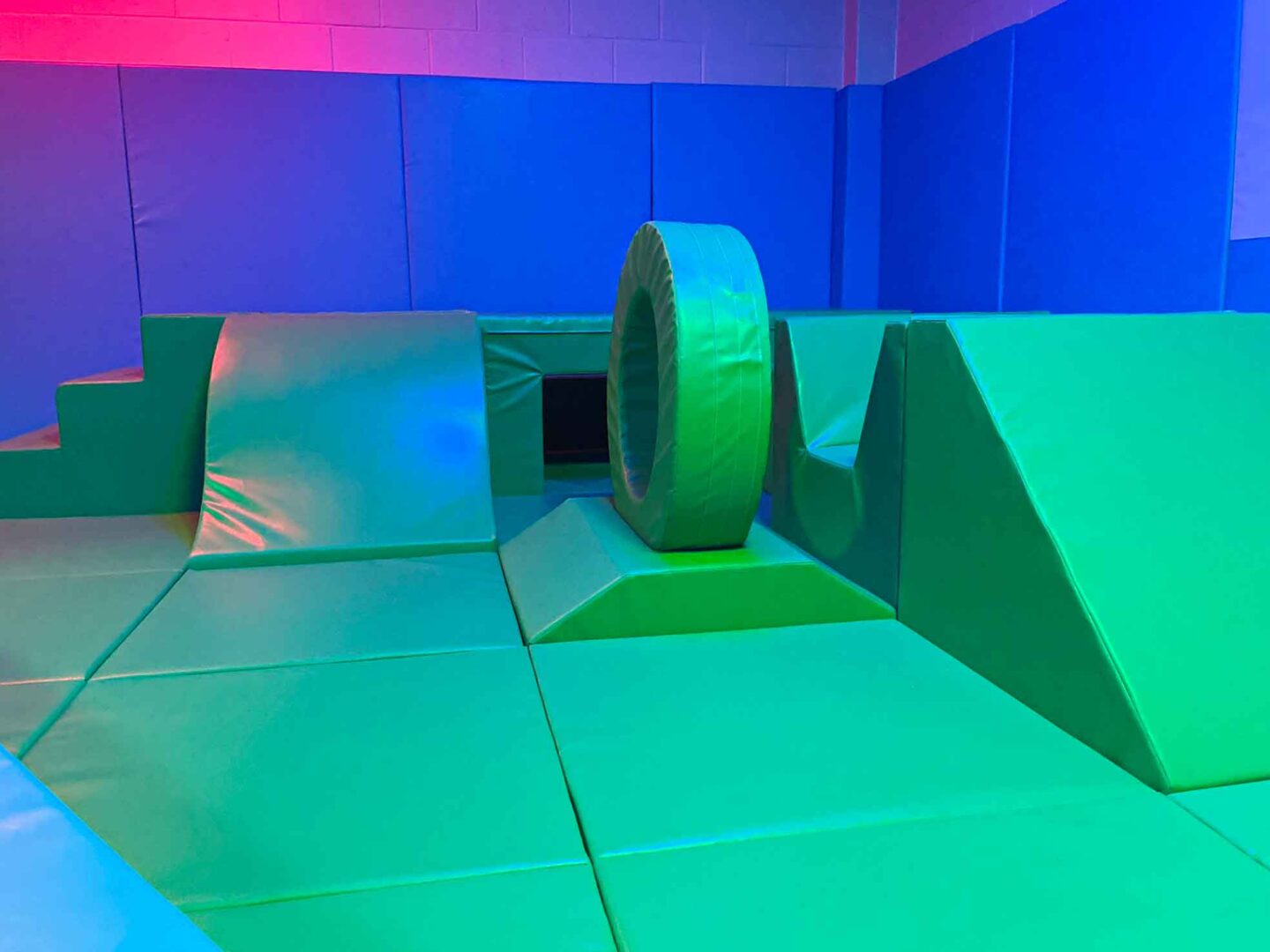 Green shape blocks for exploration as part of the movement area at St Giles School, designed by Play Creations.