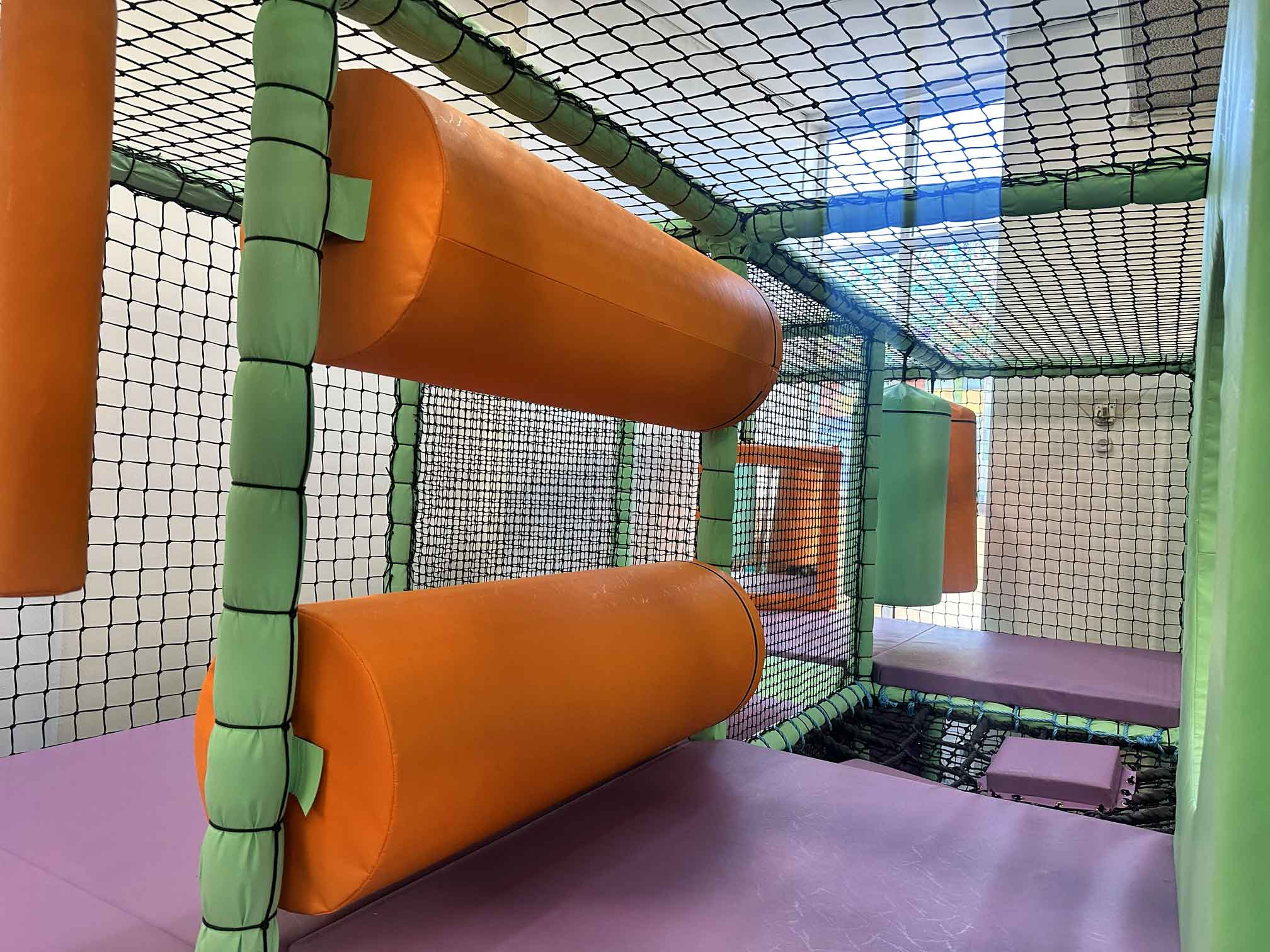 Orange horizontal rollers for Temple Park Centre's indoor softplay area designed by Play Creations