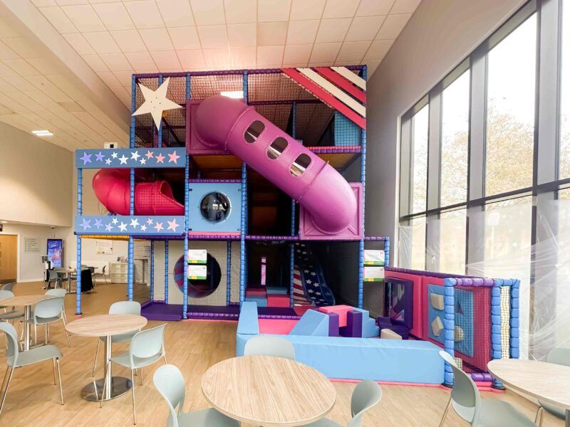 RAF Lakenheath's purple, blue and pink stars and stripes themed indoor softplay area, designed by Play Creations