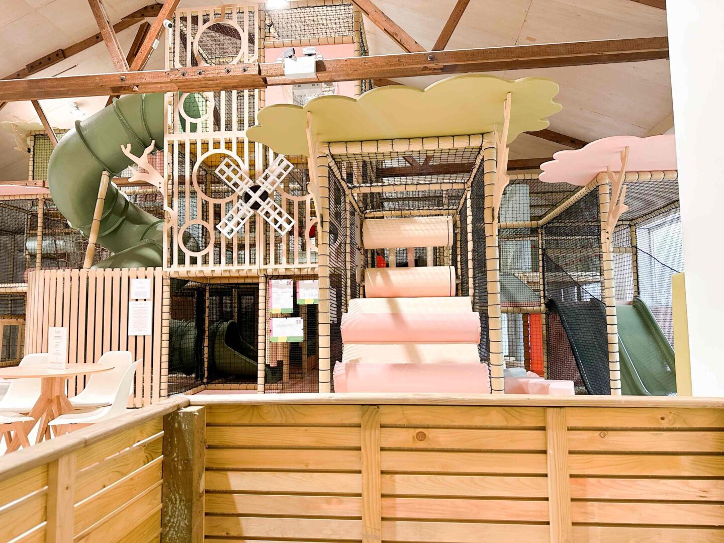 The Play Hut indoor softplay bespoke timber decorative features including two timber tree trunks and a timber cloud shaped leaf designed fitted with LED lighting. This was designed by Play Creations