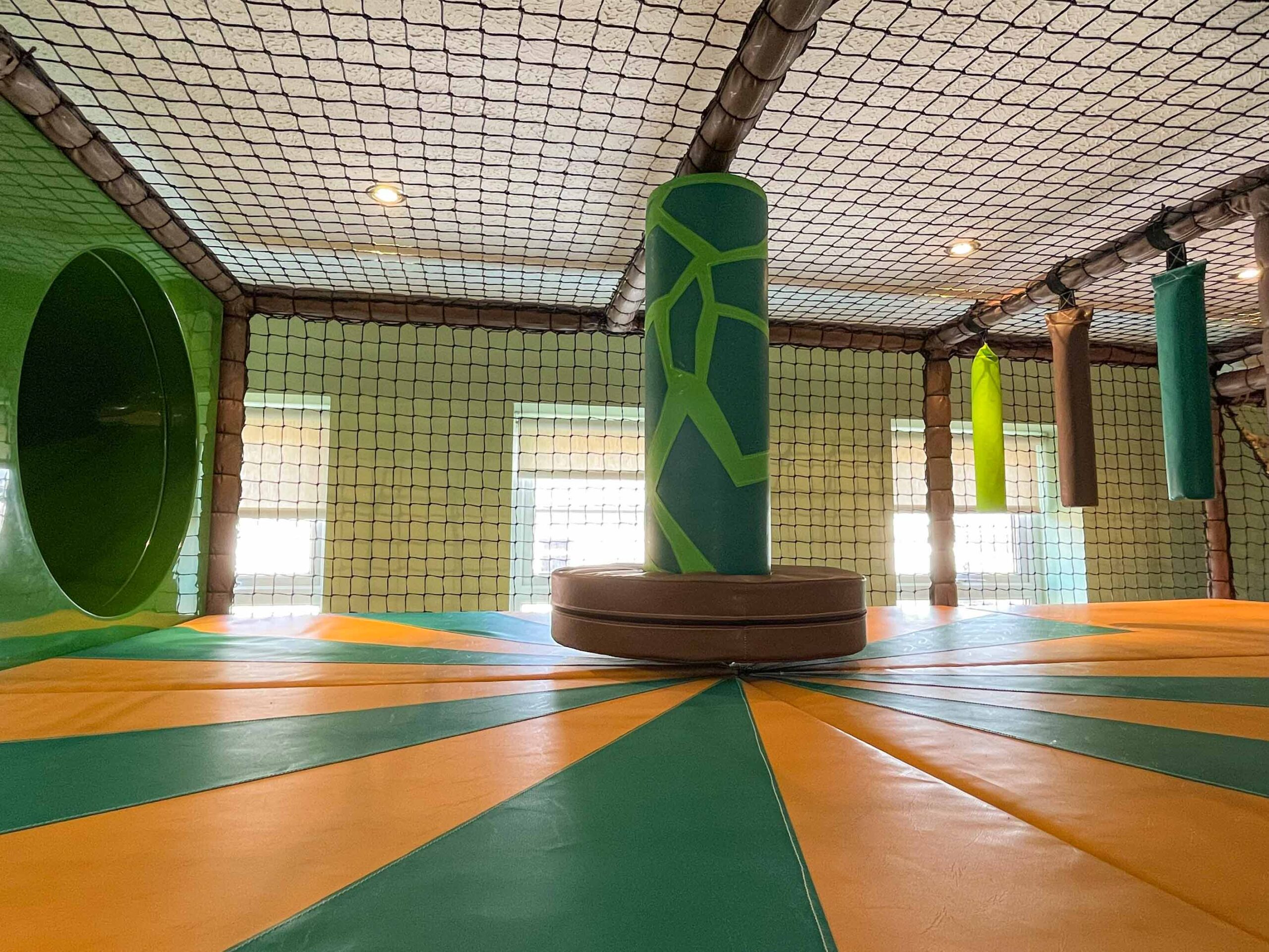 Dizzy Disc with Applique Floorboards, jungle theme, found at Hunter's Quest's softplay in Magherafelt designed by Play Creations Ltd.