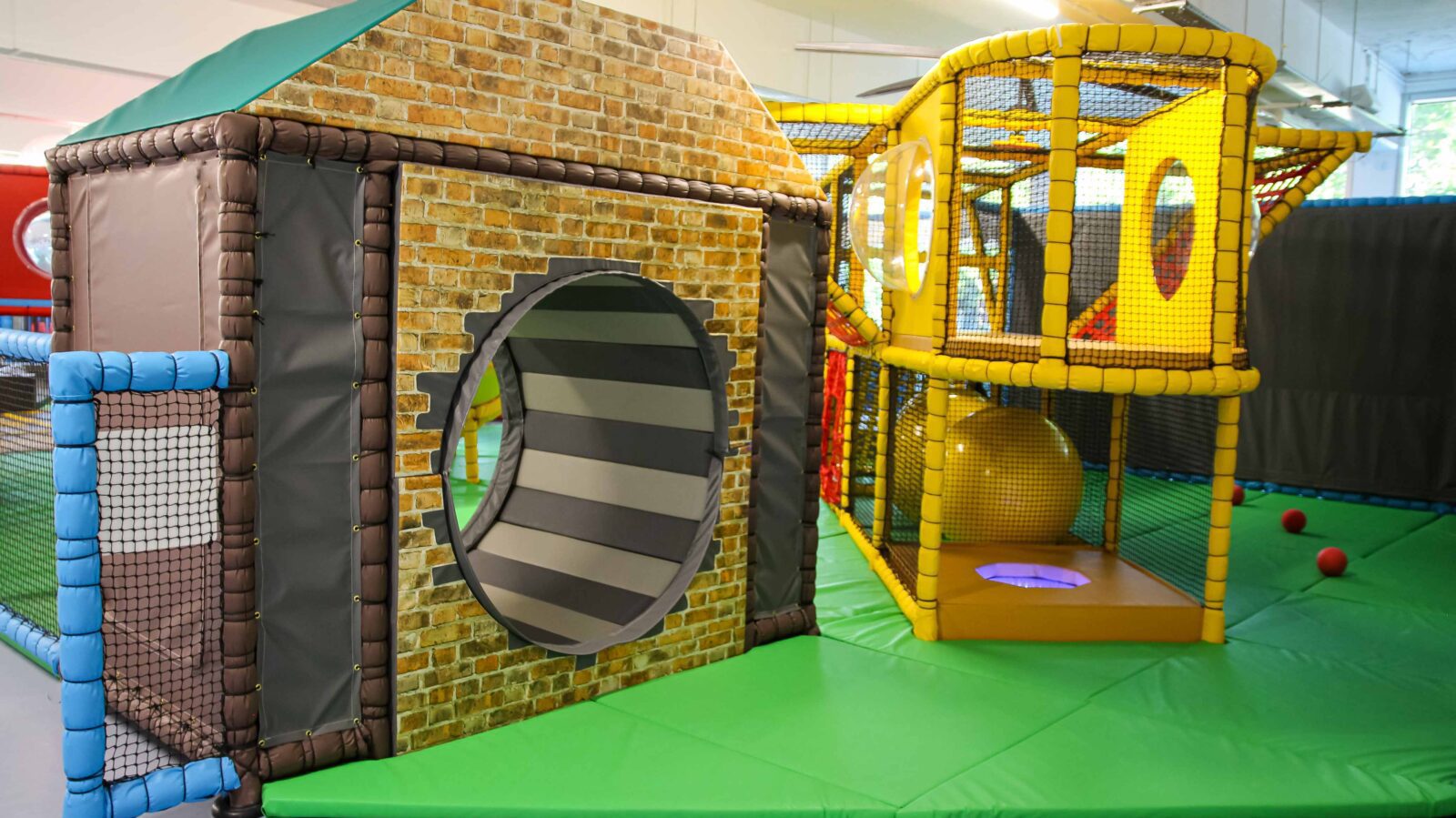 Grey Vortex Wheel inside of a softplay house found at the RAF Museum's indoor play area